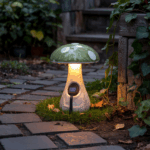 A solar mushroom garden stake light brightening up an area beneath a tree.